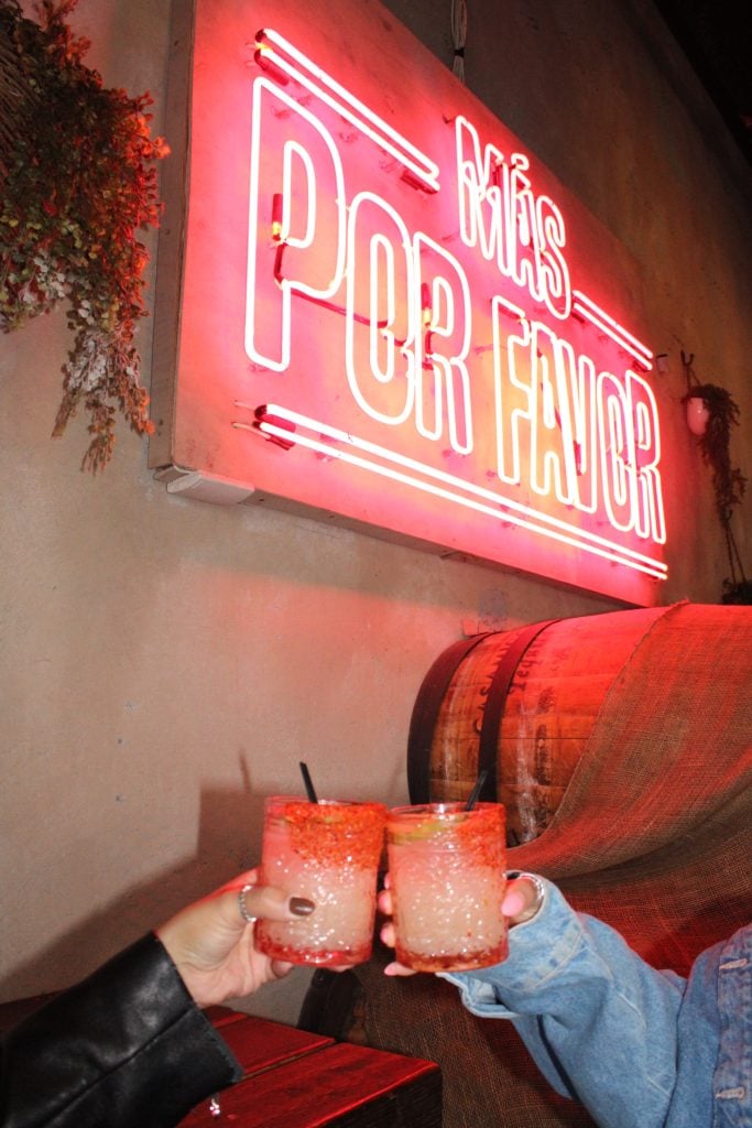 a group of people holding drinks