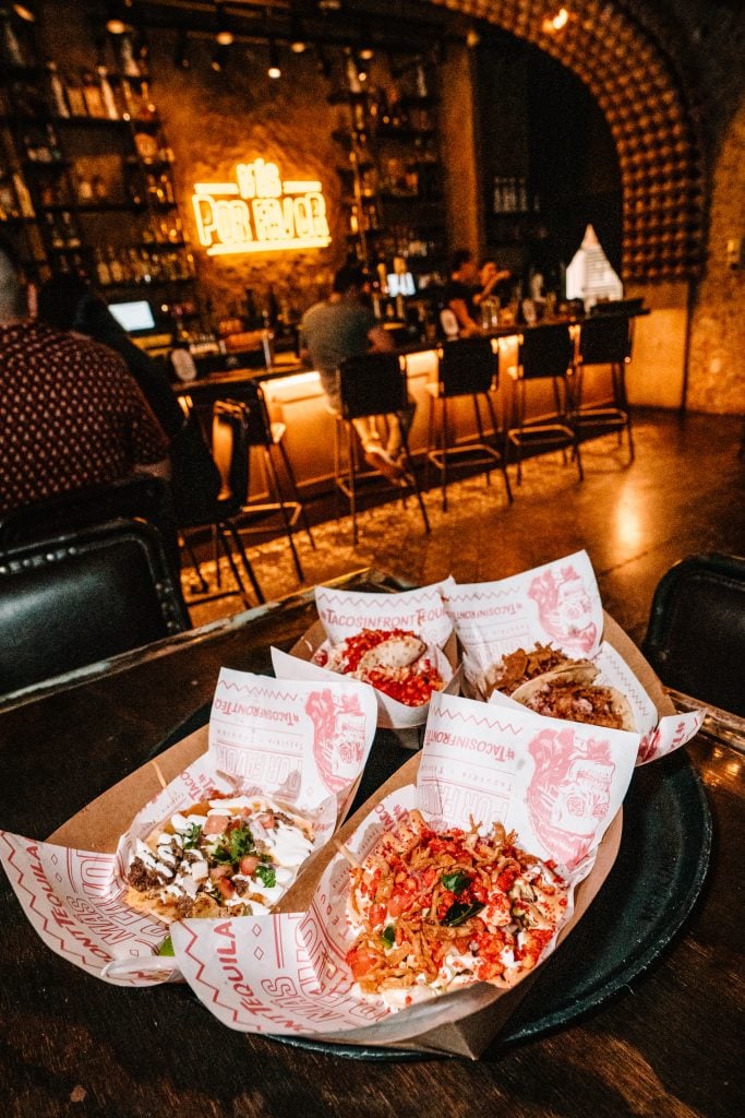 a group of tacos on a table