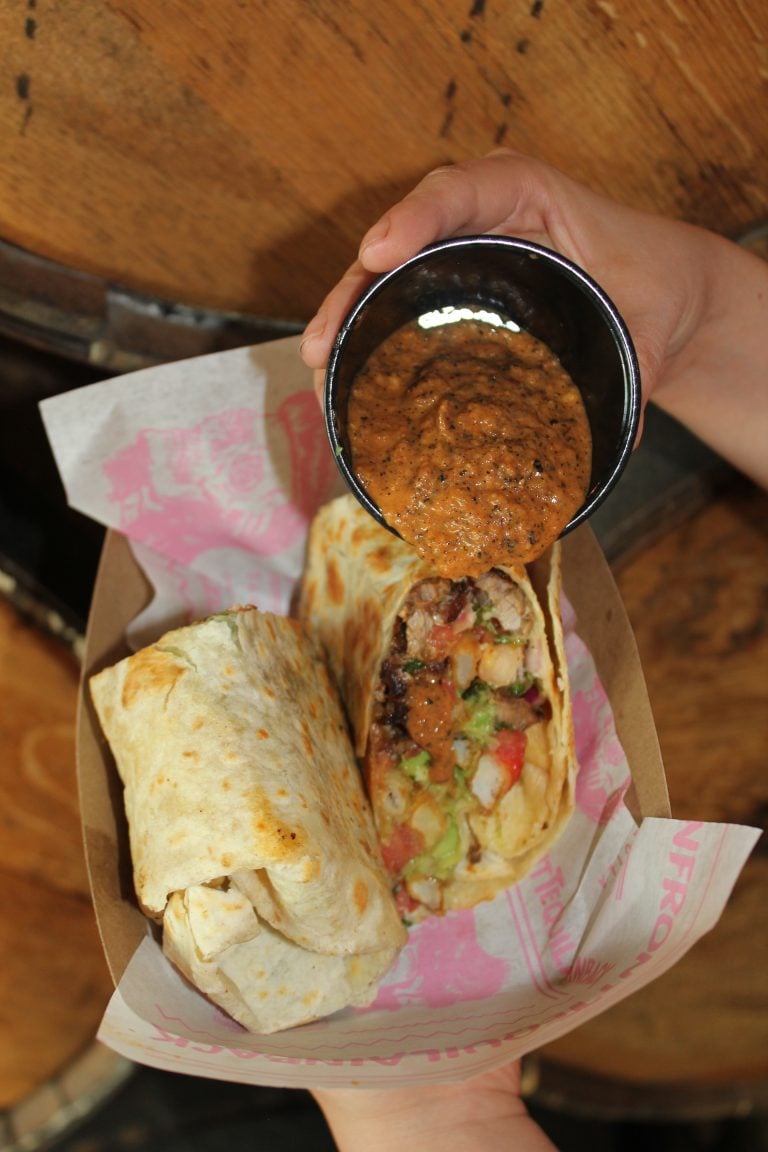 Plate of tacos al pastor with pineapple served at Más Por Favor in Las Vegas