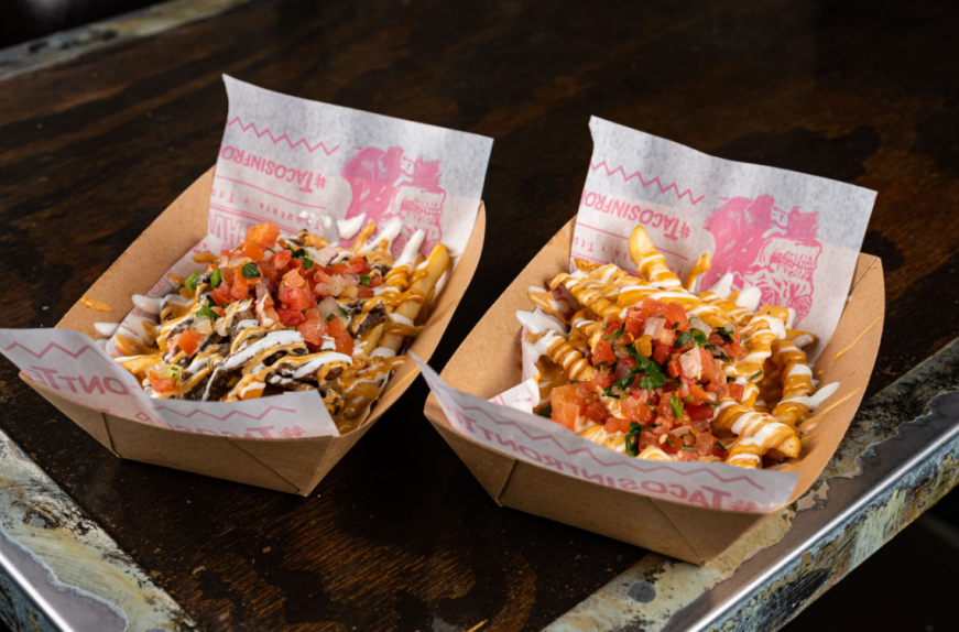 The best Mexican loaded fries in Las Vegas topped with creamy nacho cheese, chipotle sauce, sour cream, and fresh pico de gallo at Más Por Favor.