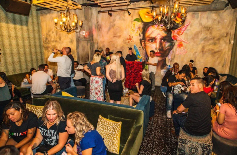 Lively interior of Más Por Favor in Las Vegas where locals enjoy burritos and tacos in a vibrant taco shop and speakeasy setting